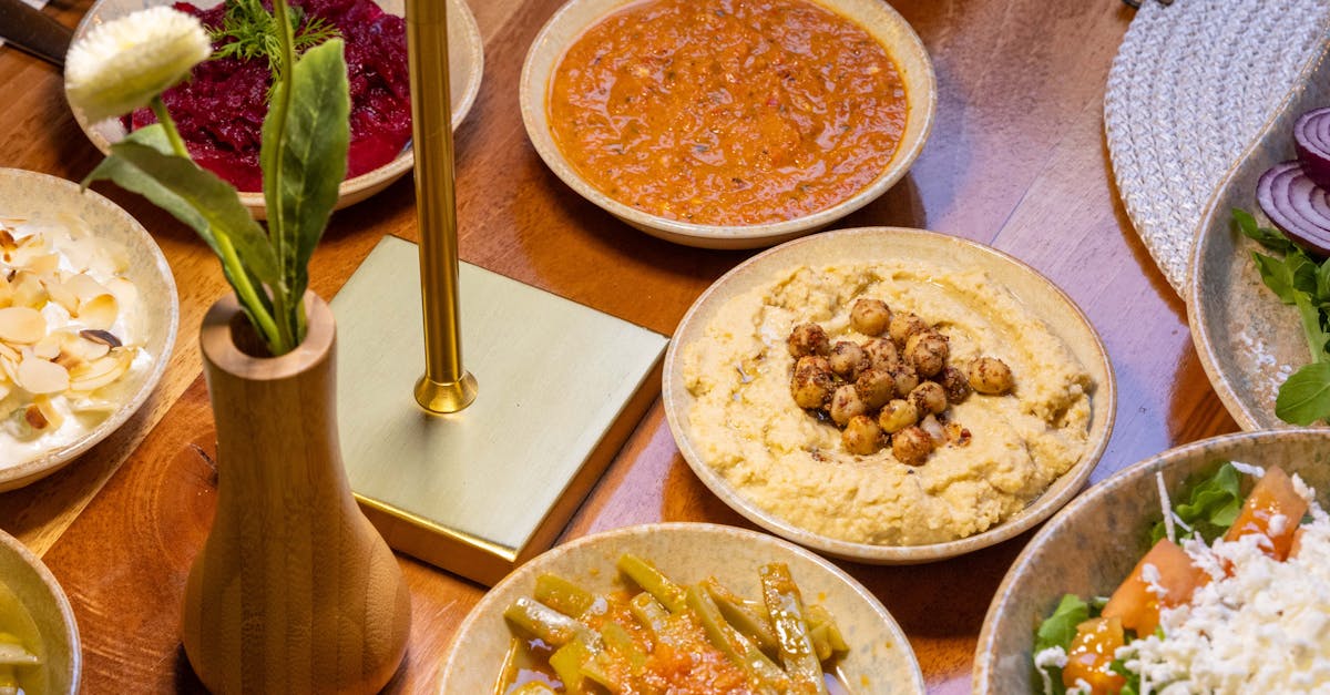 An array of delicious Mediterranean dishes arranged on a wooden table, perfect for sharing.